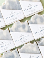 Sea Salt Lily soap bars with visible branding on a light green background